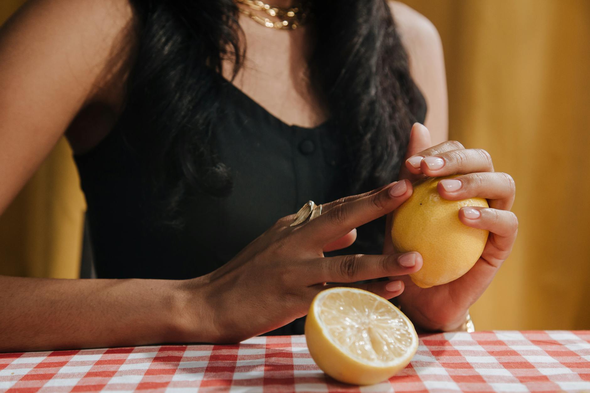 Bright yellow lemons on a soft pastel background, symbolizing fresh approaches to pleasure timing