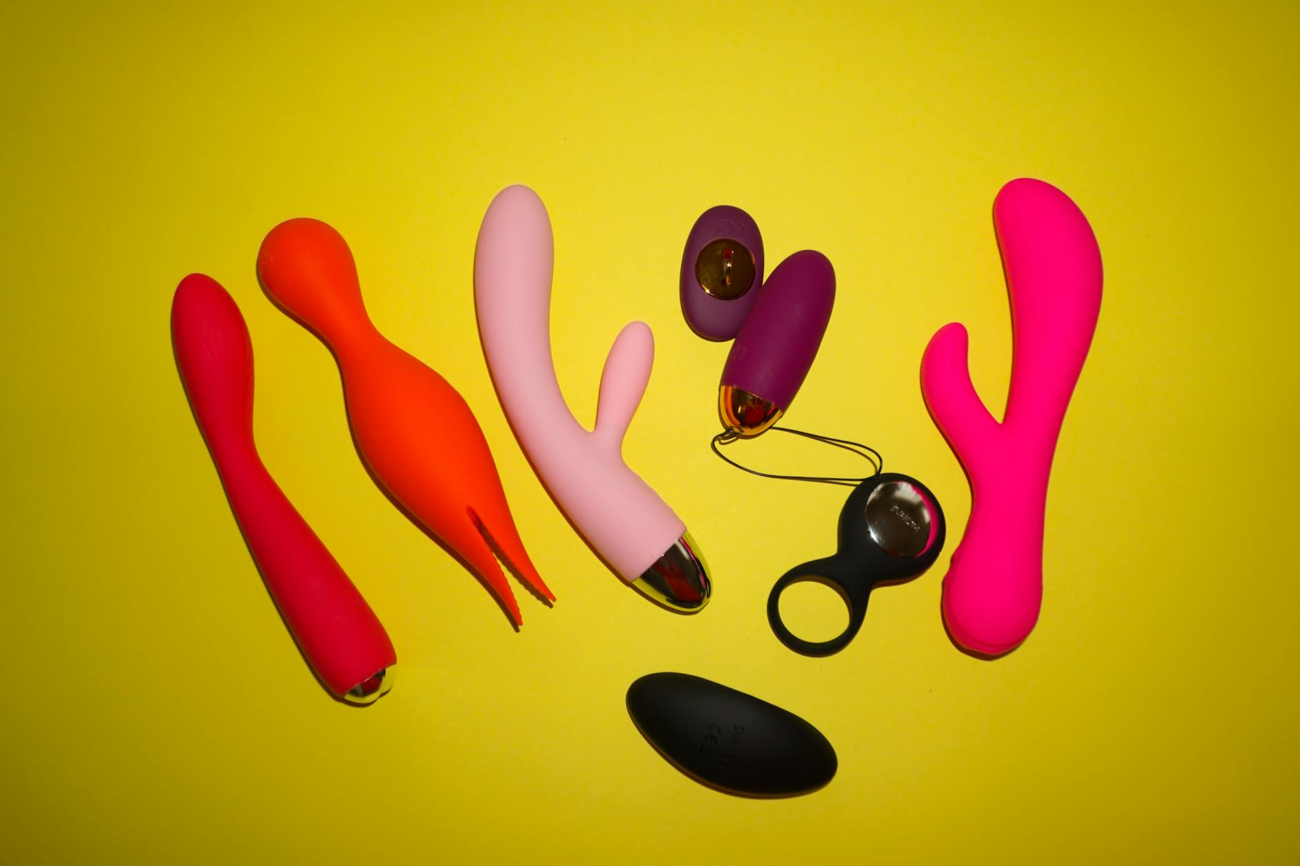 Fresh lemons on a bright yellow background, symbolizing the vibrant pleasure of lemon vibrators